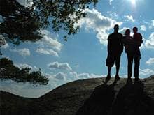 Silhouette of a family on a hill