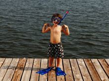 Strong Arms, scuba boy on dock