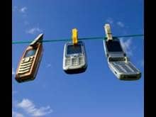 Cell phones hanging on a clothes line