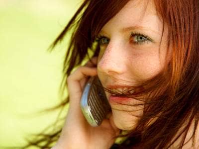 Redheaded woman on cell phone
