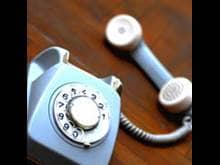 Light blue old-fashioned rotary phone