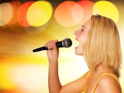 Woman singing loudly, karaoke