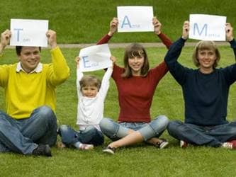 Family spelling out TEAM