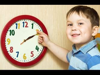 teaching patience - boy learning to tell time