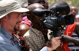 Kenyans playing with video camera