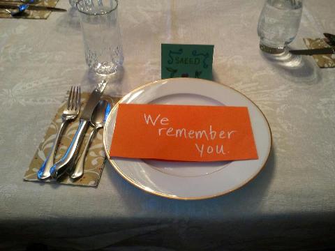 An empty place setting at the Abedini table