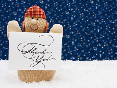 Puppet holding thank you card