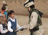 Soldiers handing out school supplies in Iraq Photo by Beliefnet member pillywiggin
