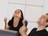Man and woman thumbs up and excited at work