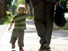 Dad and toddler holding hands