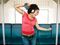 Woman with headphones on subway
