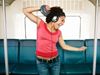 Woman with headphones on subway