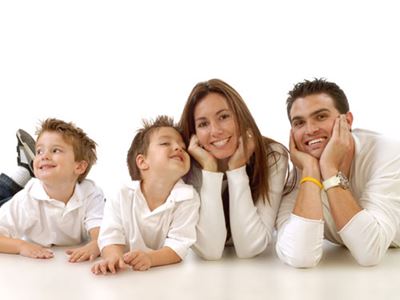 Happy smiling family in white