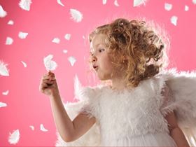 Little angel girl with feathers