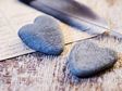 Heart-shaped stones feather letter