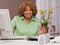 Happy woman at a desk