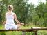 Woman meditating outdoors