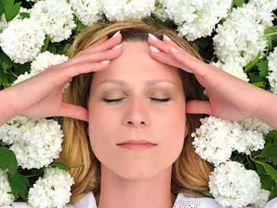 Woman relaxing among flowers
