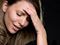 Upset woman stroking her brow