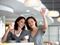 Young women drinking coffee and waving