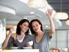 Young women drinking coffee and waving