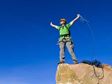 Man on Top of Cliff