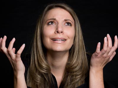 A woman desperate with her hands up