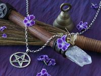 Purple cloth, pentagrams, broomstick, crystal wand, bell