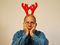 Sad man with reindeer horns
