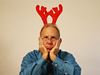 Sad man with reindeer horns