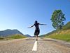 Woman walking down road