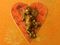 Gold cherub on red heart