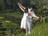 Man and woman walking near a pond on a date