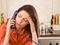 Woman with headache on phone