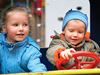 Kids playing with toy steering wheel