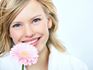 smiling woman with flower