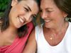 Mother and daughter smiling