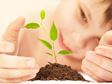 teaching patience - child watching a plant grow