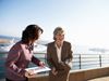 Two businesswomen on pier