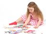 girl doing  puzzle