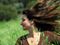 Woman in a breezy meadow