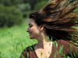 Woman in a breezy meadow