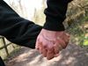 Couple holding hands