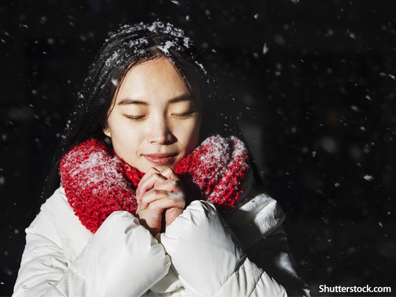 people praying winter snow