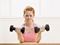 Woman lifting heavy weights