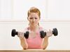 Woman lifting heavy weights