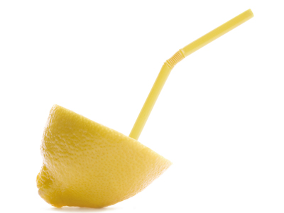 Lemon half with straw