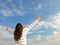 Woman with arms out to sky