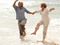 Couple frolicking in the ocean