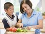 Grandmother and grandson cooking